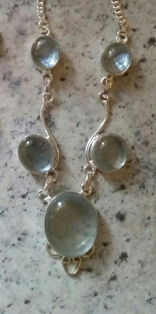 Silver and white topaz