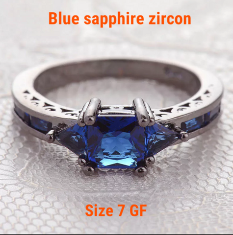 Black gold filled, blue zircon, size 7