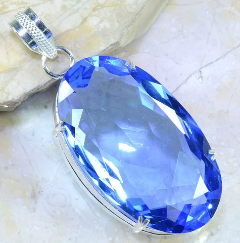 Silver, blue iolite pendant