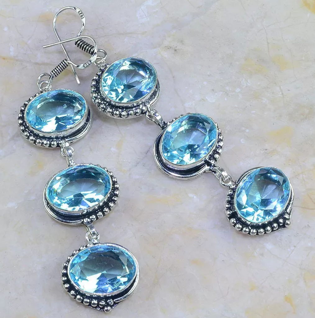Silver, blue topaz earring