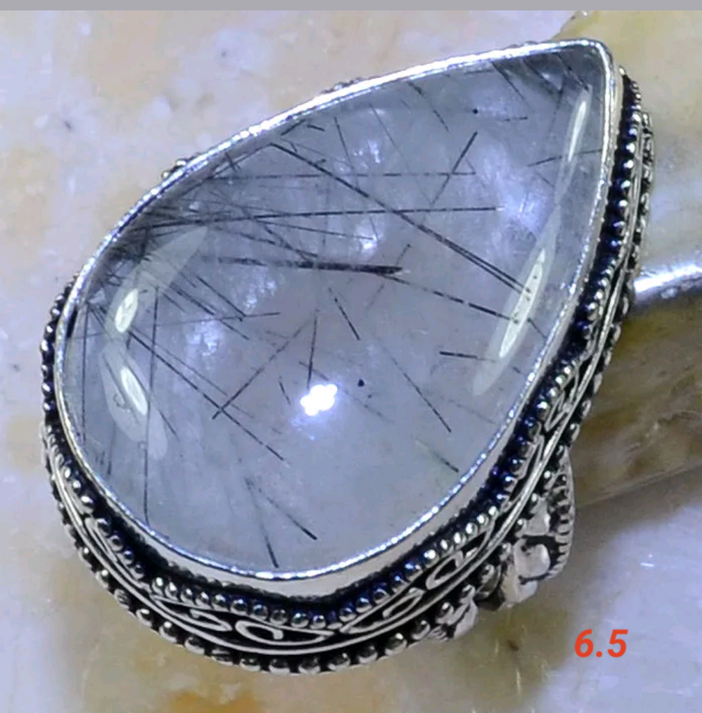 Silver, tourmalinated quartz size 6.5