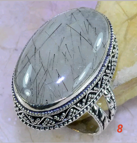 Tourmalinated quartz. Size 8