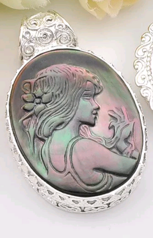 Silver, carved abalone pendant
