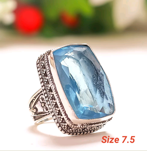 Silver, blue topaz size 7.5